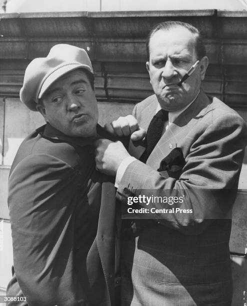 American comedy duo Bud Abbott and Lou Costello who starred in over 35 films together, during a visit to England.