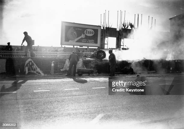 Smoke conceals Pierre Levegh's Mercedes which crashed into the crowd at the Le Mans 24 hour race killing 80 people including the driver and injuring...