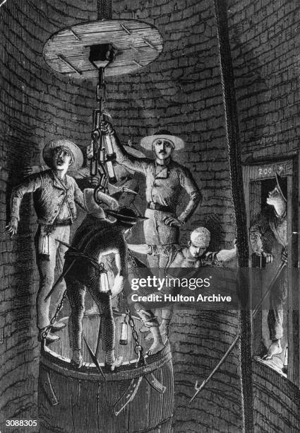 Miners going down a shaft hang on to a chain attached to a large barrel on whose rim they are standing. After an engraving by Bonhomme.