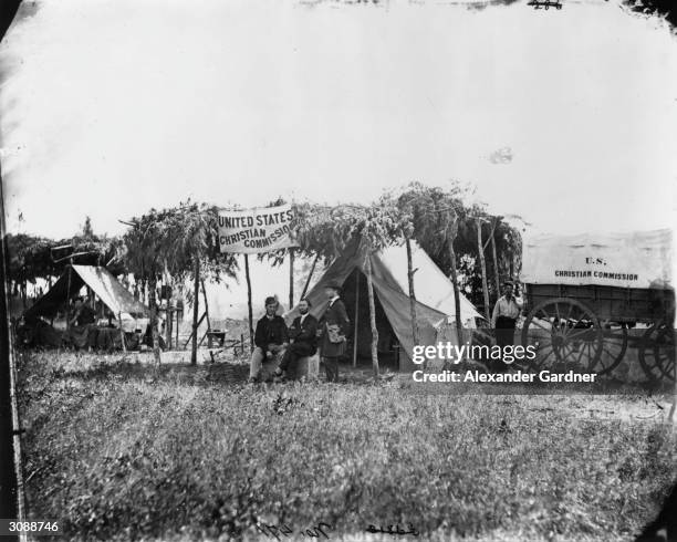 Members of the US Christian Commission at a Union camp near Germantown, Maryland. The commission, founded by the YMCA, helped regimental chaplains...