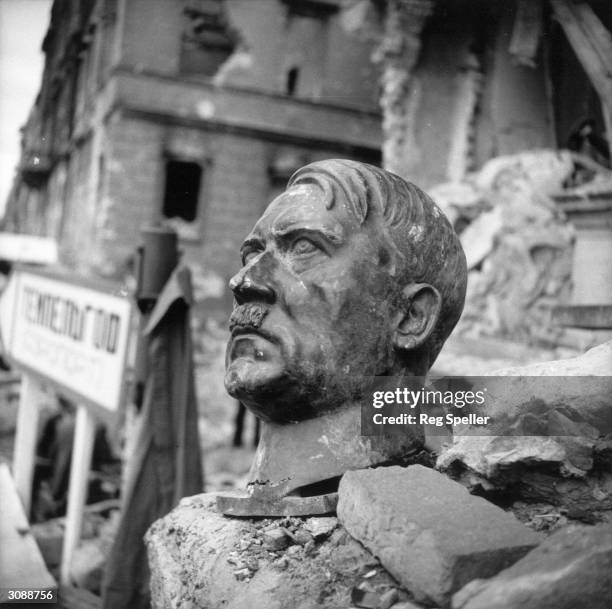 Bust of Adolf Hitler lies amidst the ruins of the Chancellery, Berlin.