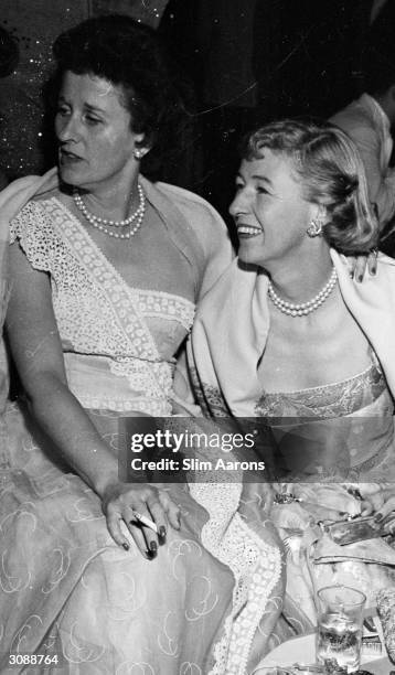 Betsey Whitney and on the right Mary Benedict Cushing at a party given by Jock Whitney. A Wonderful Time - Slim Aarons