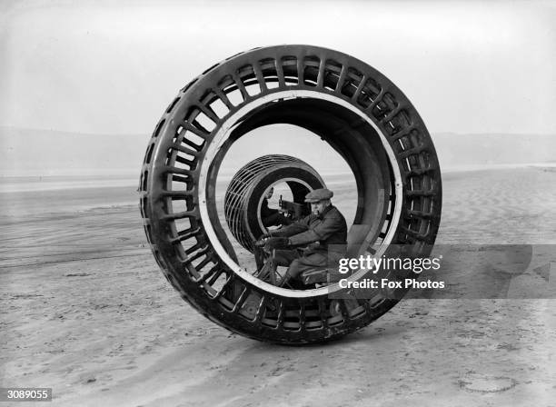 Electronically driven wheels which revolve while the drivers remain stationary, the invention of J A Purves and his son of Taunton, are tested at...