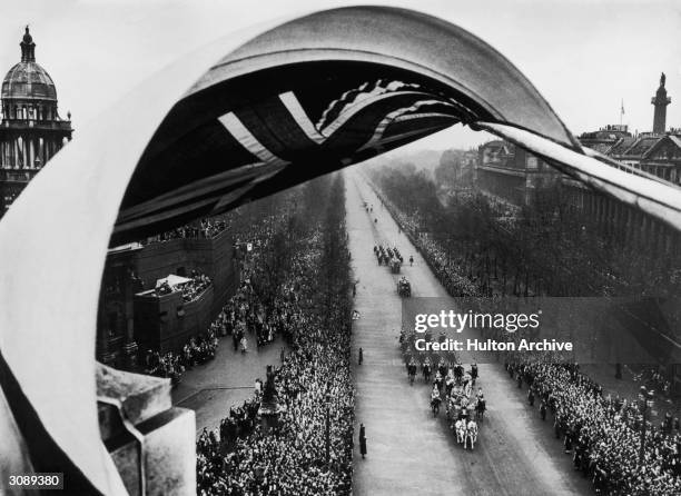 Princess Elizabeth is driven along the Mall to Westminster Abbey in the Irish Coach with a sovereign's escort of the Household Cavalry for her...