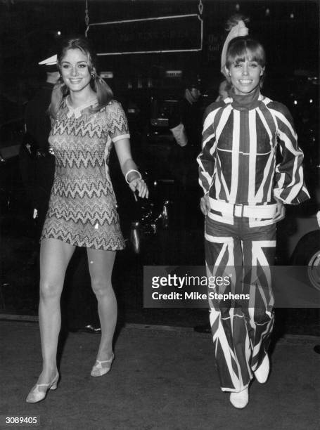 On the left in a mini-dress, Marlene Schwerter from Berlin, and in a Union Jack trouser suit, Lois Hamel from Amsterdam competing for the title of...
