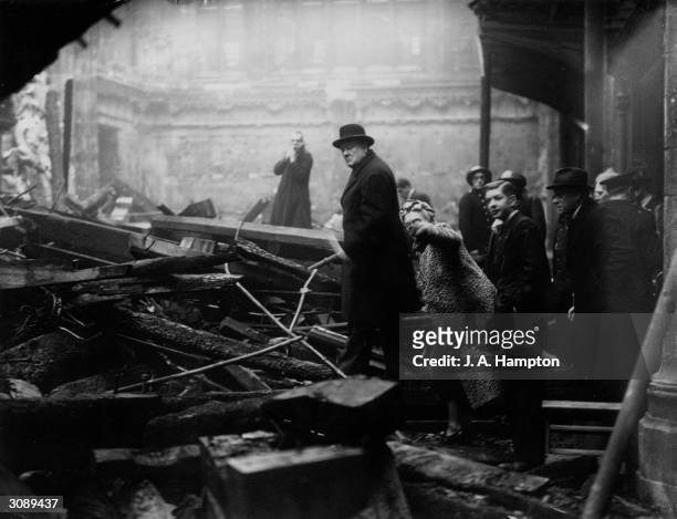 British Prime Minister Winston Churchill and his wife inspect bomb-damage in the City of London during the Blitz, 31st December 1940.