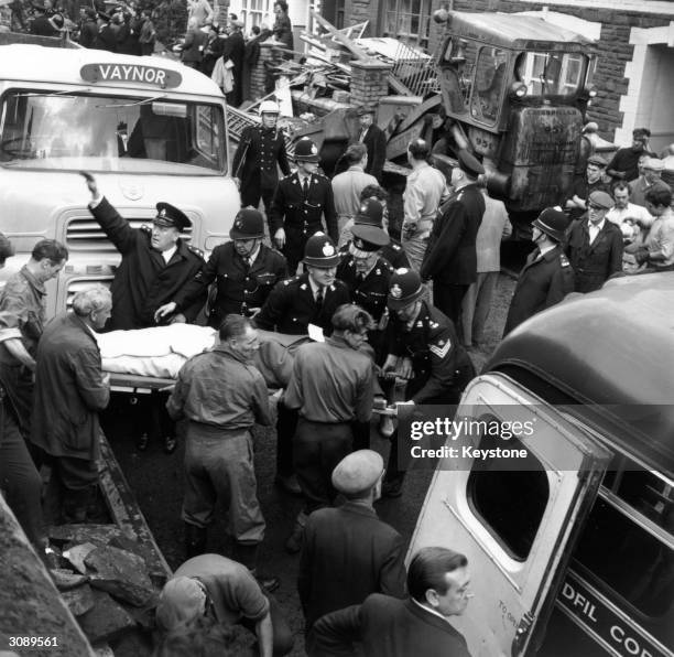 Rescue workers at the scene of the wrecked Pantglas Junior School at Aberfan, South Wales, where a coal tip collapsed killing over 190 children and...