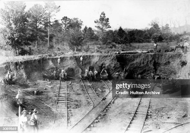 Men at work at the Yourtree Iron Ore Mine near Russellville. Tracks of the BS and TR railway are in the foreground.