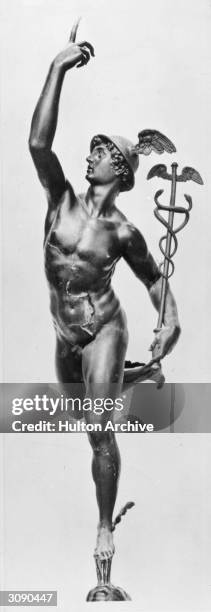 Giambologna's bronze statue of the Roman god Mercury, messenger of the immortals, in the National Museum in Florence. He is wearing a winged helmet...