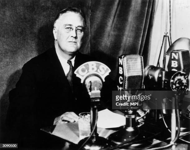 American politician and the 32nd President of the United States, Franklin Delano Roosevelt delivering one of his fireside chats to the nation....