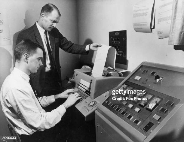 Systems engineer mans the telex link of a Student Response System installed at Syracuse University, New York by the General Electric Research and...