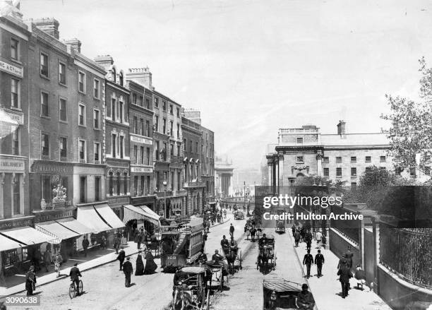 The bottom of Grafton Street, Dublin, with the facade of Trinity College at the foot.