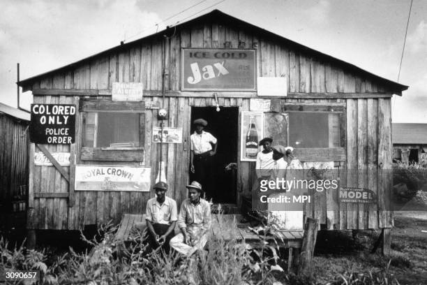 Ca. 1941: Segregated store for migrant workers in Belle Glade, Florida, 1941. Police-order segregation was designed to assure only African-Americans...