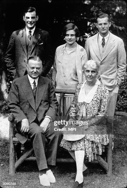 Herbert Hoover , the former President of the United States with his wife, sons and daughter-in-law.