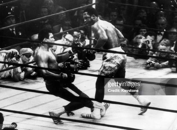 In a title fight at Madison Square Gardens, New York, Muhammad Ali goes down in the 15th round to a left hook from world heavyweight champion Joe...