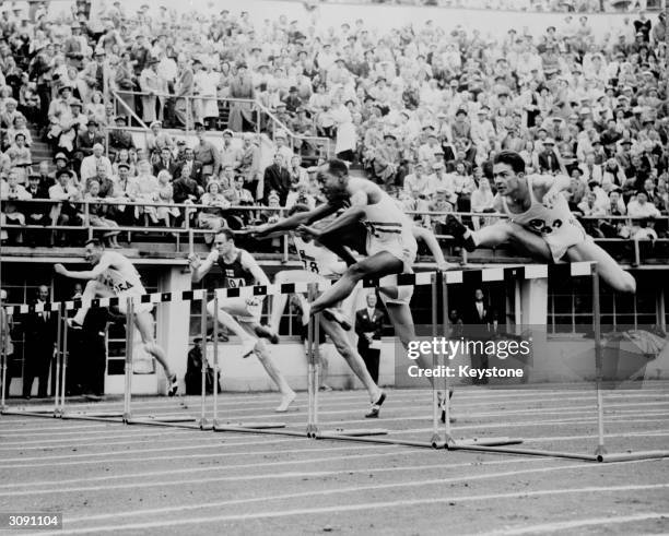 Harrison Dillard of the USA in action during the first heat of the men's 110 metres hurdles at the 1952 Helsinki Olympics. He went on to win the gold...