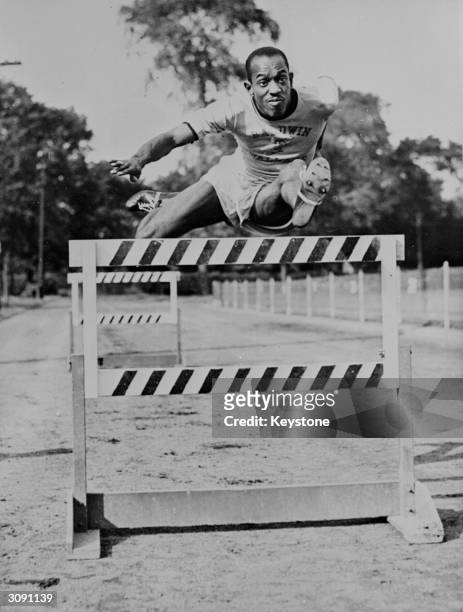 American hurdler Harrison Dillard in action training for the forthcoming 1948 London Olympics. Despite holding the world record for the 120 yards...
