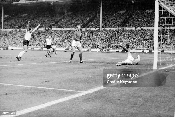 German footballer Haller scores the first goal for West Germany during the World Cup Final against England at Wembley Stadium, London.