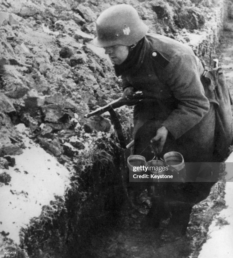 German Rations During Ww2 A German soldier brings soup rations to the front line during World ...
