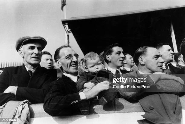 Young fan with his father in the spectators gallery at Ibrox Stadium, Glasgow to watch a Rangers v Celtic football match. Original Publication:...