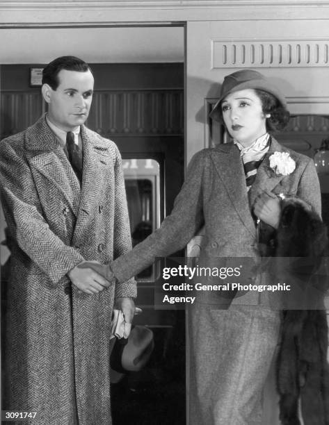 American actress Bebe Daniels bids goodbye to Victor Varconi, in a scene from the film, 'The Song You Gave Me'.