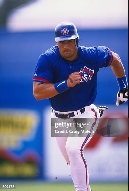 Outfielder Jose Canseco of the Toronto Blue Jays in action during a spring training game against the Philadelphia Phillies at the Grant Field in...