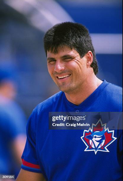 Outfielder Jose Canseco of the Toronto Blue Jays in action during a spring training game against the Philadelphia Phillies at the Grant Field in...