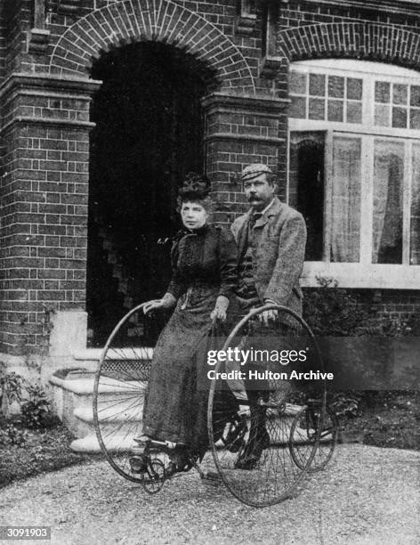 British author and physician Dr Arthur Conan Doyle and his wife, Louisa on a tandem cycle, circa 1895. Original Artist: By Elliott & Fry.