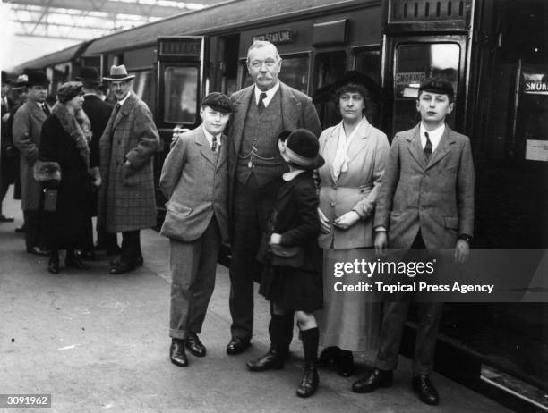 Writer of the Sherlock Holmes mysteries, Dr Arthur Conan Doyle with his family on Waterloo station en-route for the USA.