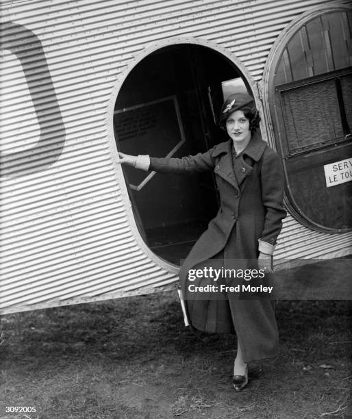 Paddy Naismith pilot and motor racer in uniform for her job as airhostess for the British Air Navigation Company.