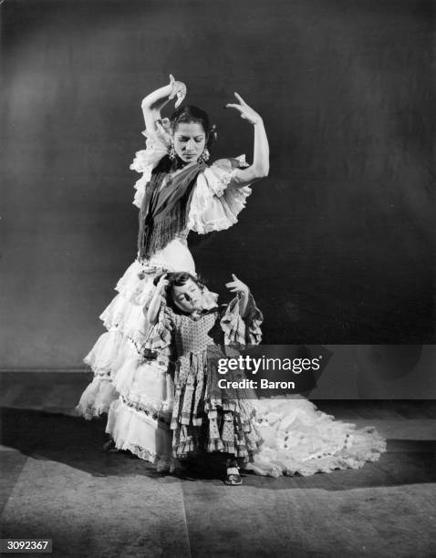 Flamenco dancer Carmen Amaya with a very young dancer.