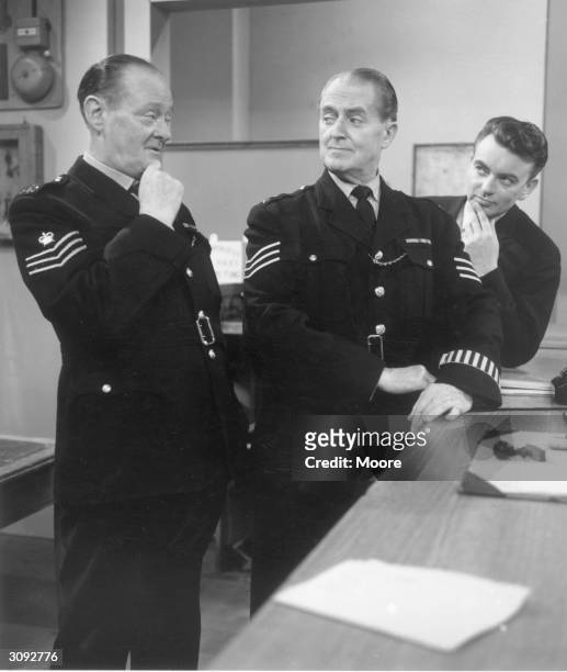 Scene from the popular BBC series 'Dixon of Dock Green, telling stories of life at an East End police station. Left to right, Arthur Rigby, Jack...