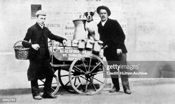 Milkman with his float, dog and boy. A caption reads,'On the milk round with Harry Hanford'.