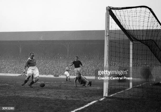 Scottish centre forward Hughie Gallacher scoring the first goal for Chelsea against Liverpool at Anfield.