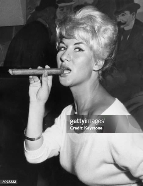 Caron Gardner, 'Miss London After Dark', at a press conference at the Latin Quarter restaurant, London, after her return from a promotional tour of...