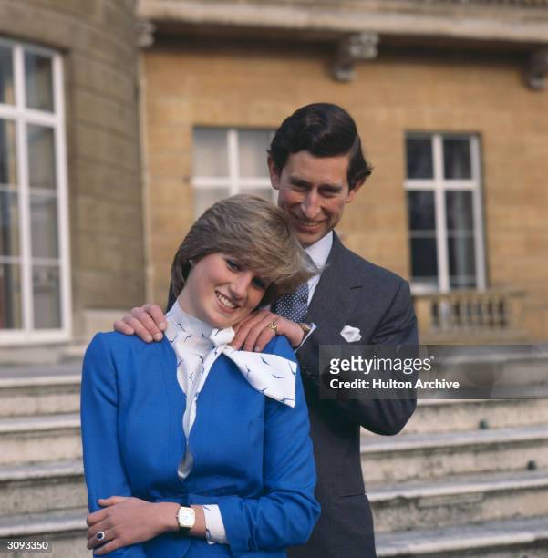 Charles, Prince of Wales laughing with his fiancee, Lady Diana Spencer , outside Buckingham Palace, after announcing their engagement, London, 24th...