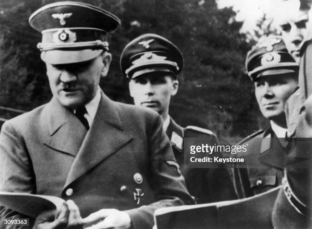 Adolf Hitler and Nazi Party Leader Martin Bormann somewhere in the Balkans.