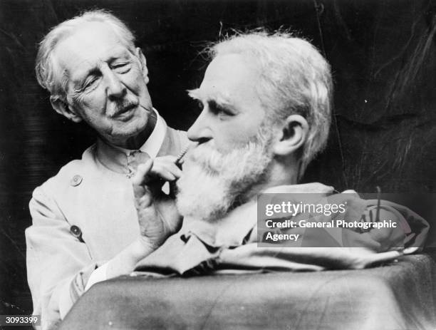 John Tussaud, the great grandson of Madame Tussaud working on a model of the Irish playwright and social critic, George Bernard Shaw .