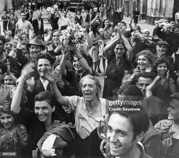 Crowds in Italy celebrate their liberation by the Allied forces towards the end of World War II.