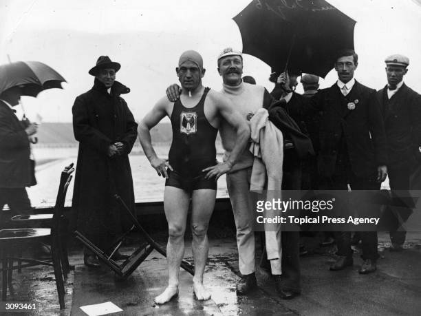 British swimmer Henry Taylor, who won the 400 metre race at the London Olympic Games at White City, with his trainer.