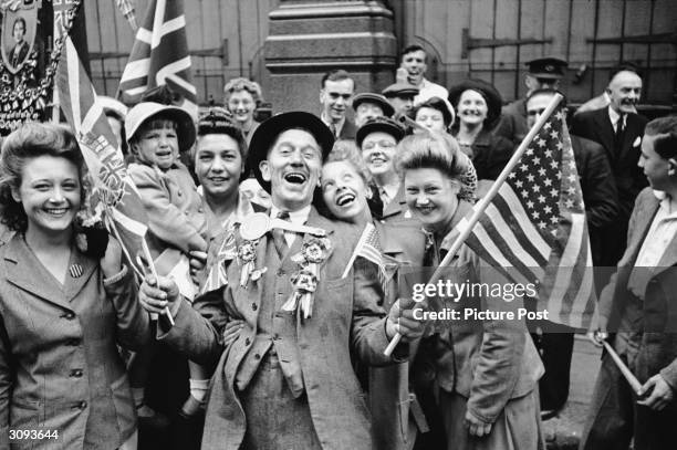 Ecstatic crowds celebrating VE Day in London's Piccadilly, at the end of World War II, 8th May 1945. Original Publication: Picture Post - 1991 - This...