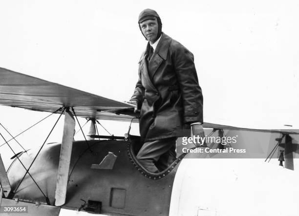 American aviator Colonel Charles Augustus Lindbergh , who in 1927 became the first person to make a non-stop solo flight across the Atlantic.