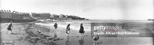 Children paddling at the beach in Bangor, County Down, Ulster's largest seaside resort.