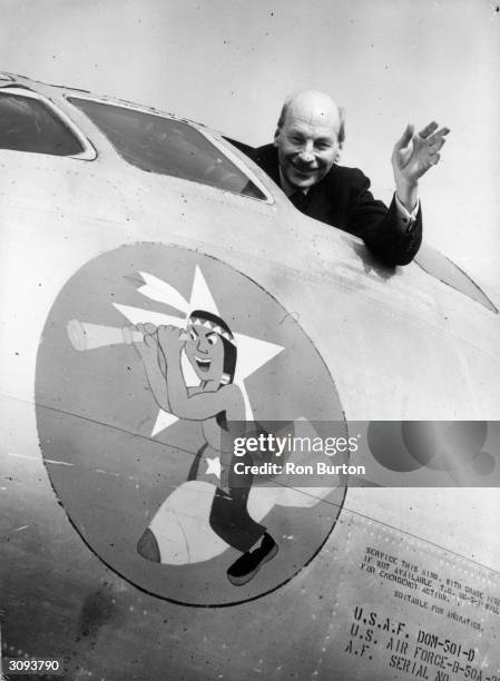 British prime minister Clement Attlee waves from the cockpit of a US B 50 aircraft at Marham.