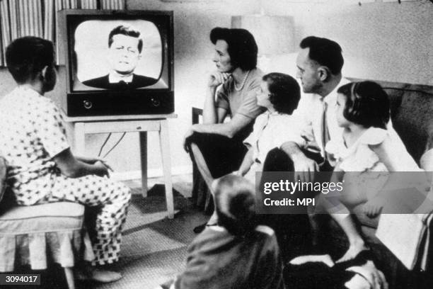 Family watching President John Kennedy on television.