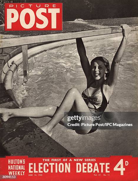 British skating star and actress Belita dangles from the diving board at the swimming pool of the Town House Hotel, Los Angeles. She is one of the...
