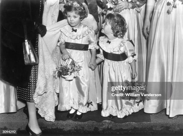 Bridesmaids and sisters 4-year-old Camilla and 3-year-old Annabelle Shand, at the wedding of Jeremy Cubitt and Diana du Cane in St Mark's church,...