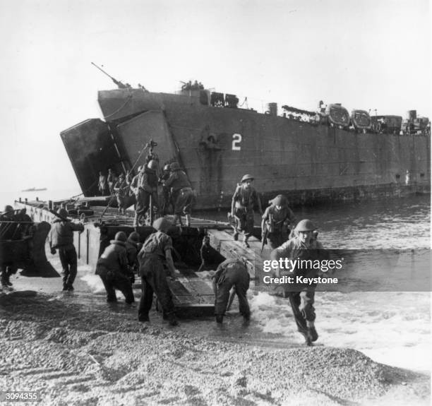 Troops coming ashore from a landing craft during the Salerno landings in Italy.
