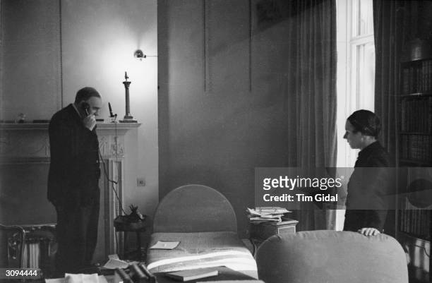 English economist John Maynard Keynes, 1st Baron Keynes, and his wife, Russian ballerina Lydia Lopokova, at their home in Gordon Square, London....