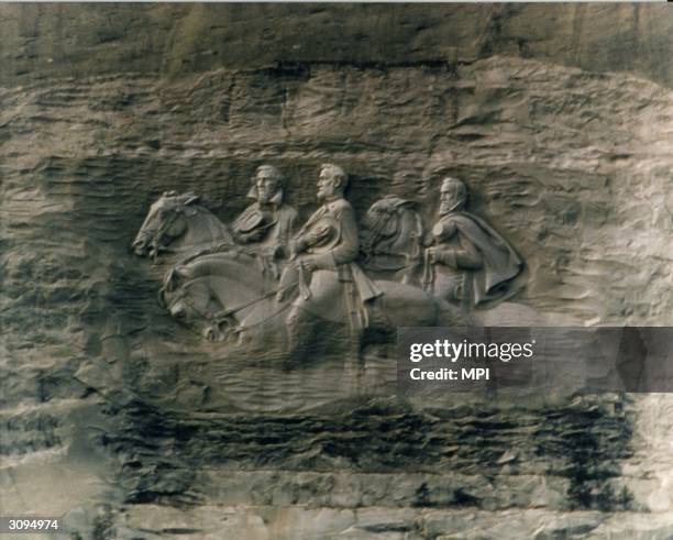 The Confederate Generals carved into Stone Mountain in Stone Mountain National Park, Georgia. The relief depicts Robert E Lee, Stonewall Jackson and...